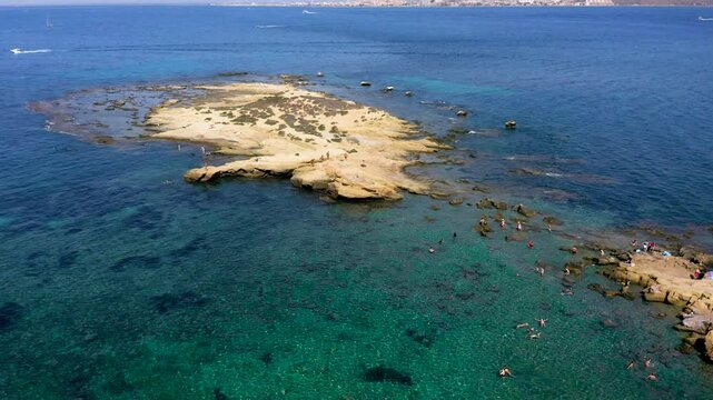 Aerial view of the south part of Tabarca Island with the beach and anchorage. The smallest island with permanent inhabitants in Spain. In the Mediterranean of Alicante.