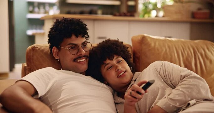 Relax, watching tv and movie with couple on sofa for channel surfing, streaming service and cuddle. Love, connection and happiness with man and woman in living room at home for broadcast and bonding