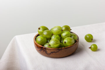 Gooseberry in a wooden bowl