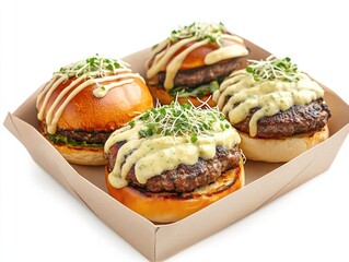 A tray of gourmet burgers topped with creamy sauce and microgreens.