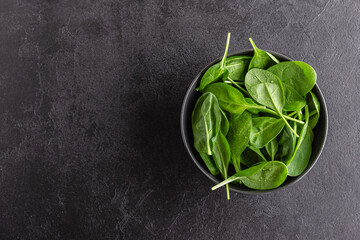 Fresh green spinach leaves in the bowl. Natural vegetarian food.