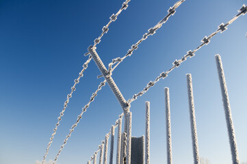 Concrete protection with a barbed wire