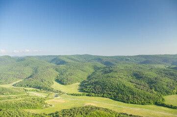 View of mountain landscape from the height of the mountain range.