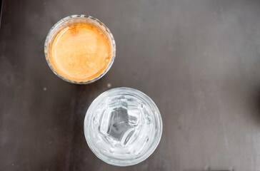 Dirty coffee served with cool water. Top view