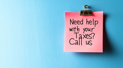 Pink Sticky Note on Blue Background With the Text Need Help With Your Taxes Call Us.