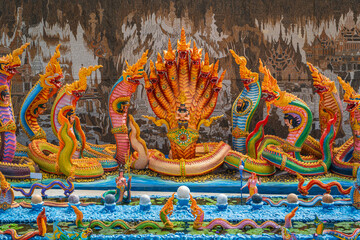 A large, colorful, and beautiful statue of the King Naga.