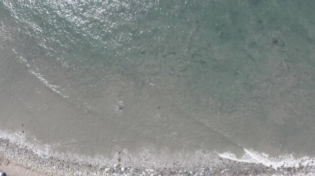 Waves rolling in to the west coast beach in California