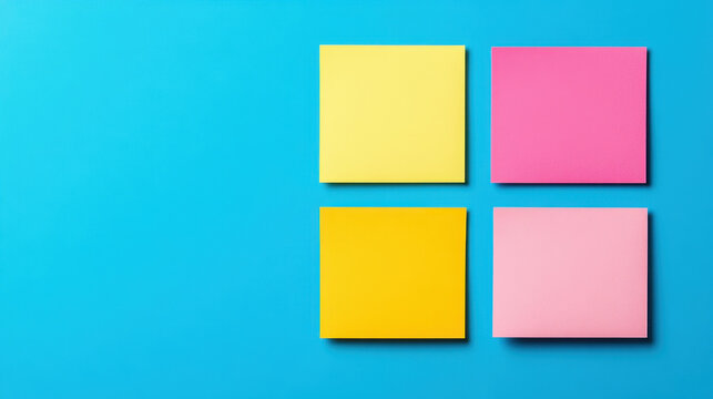 Bright sticky notes in yellow and pink on vibrant blue background create visually striking and colorful composition. Perfect for organization and creativity