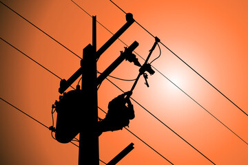 The power lineman use clamp stick (insulated tool) to closing a transformer on energized high-voltage electric power lines. The power lineman must be trained because it is a risky job.	