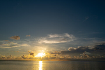 Sunset sea. Calm sea with sunset sky through the clouds over. Meditation ocean and sky background. Tranquil seascape. Horizon over the sunset sea water. Calm sea with sunset sky.