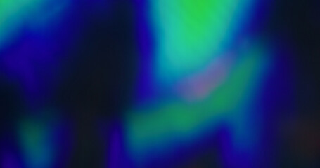 Holographic glare. Blur lens flare. Defocused light leak blue green multicolor flickers glow...