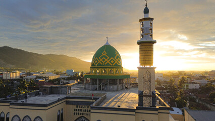 Naklejka premium Aerial view of the Mosque in the city at sunset, Gorontalo, Indonesia
