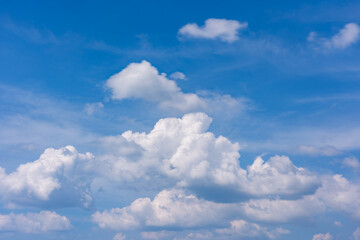 Beautiful clouds in sunny sky over sea nature background