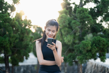 Fototapeta premium Asian woman using voice assistant on smartphone &nbsp;conversation with online assistant&nbsp;Voice chat bot conversational AI Modern Technologies.