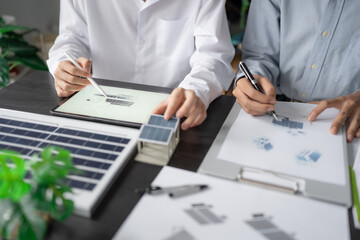 Solar panels green energy Business man working green eco friendly office business creative idea Planing Bio economy for business eco friendly professional Engineer sustainable electricity.