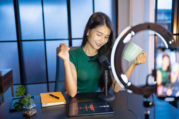 Content creator Young asian woman influencer creating content in home studio entertainment and...