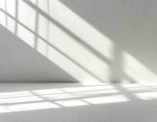 Obraz premium Soft light rays streaming across a smooth white surface, creating a serene and abstract background perfect for design, presentations, or creative projects