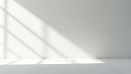 Obraz premium Soft light rays streaming across a smooth white surface, creating a serene and abstract background perfect for design, presentations, or creative projects
