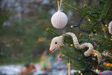 Christmas Tree Decorated with Handmade Crochet Snake and Round Ornament