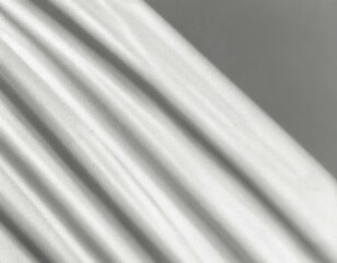 Fototapeta premium Soft light rays streaming across a smooth white surface, creating a serene and abstract background perfect for design, presentations, or creative projects. 