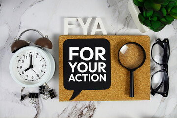 FYA - For Your Action acronym with alarm clock and magnifying glass, business concept background