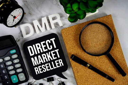 DMR - Direct Market Reseller acronym with calculator, alarm clock and magnifying glass, Business concept background