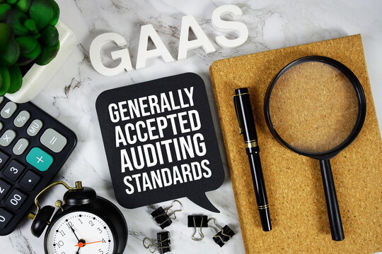 GAAS - Generally Accepted Audit Standards acronym with calculator, alarm clock and magnifying glass, Business and Financial concept background