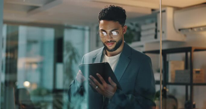 Businessman, trader and night with tablet for investment, research or corporate finance at office. Happy man, employee or investor working late with smile on technology for financial app at workplace