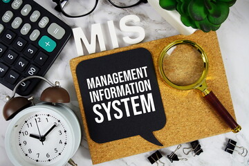 MIS - Management Information System acronym with calculator, alarm clock and magnifying glass, Business concept background © may1985