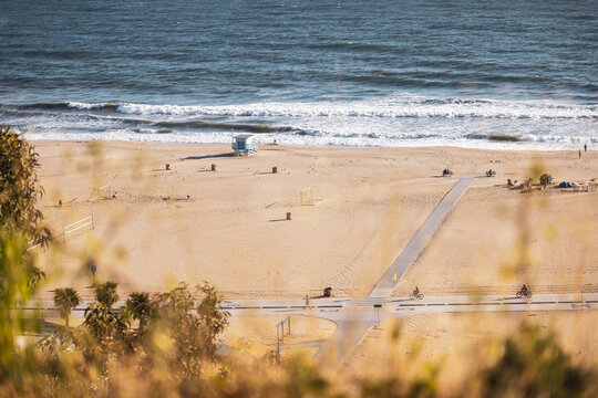 California beach almost empty with powerful waves from the Pacific Ocean 
