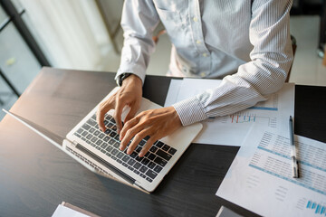Business man working using laptop computer Hands typing keyboard. Professional investor working...