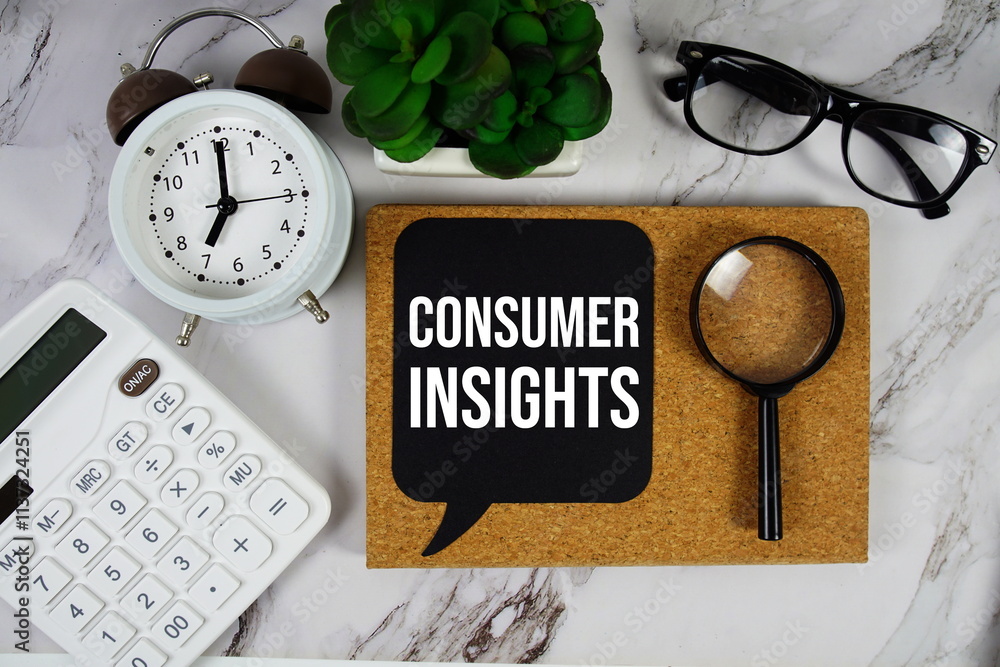 Poster consumer insights text on speech bubble with alarm clock, calculator and magnifying glass on marble 