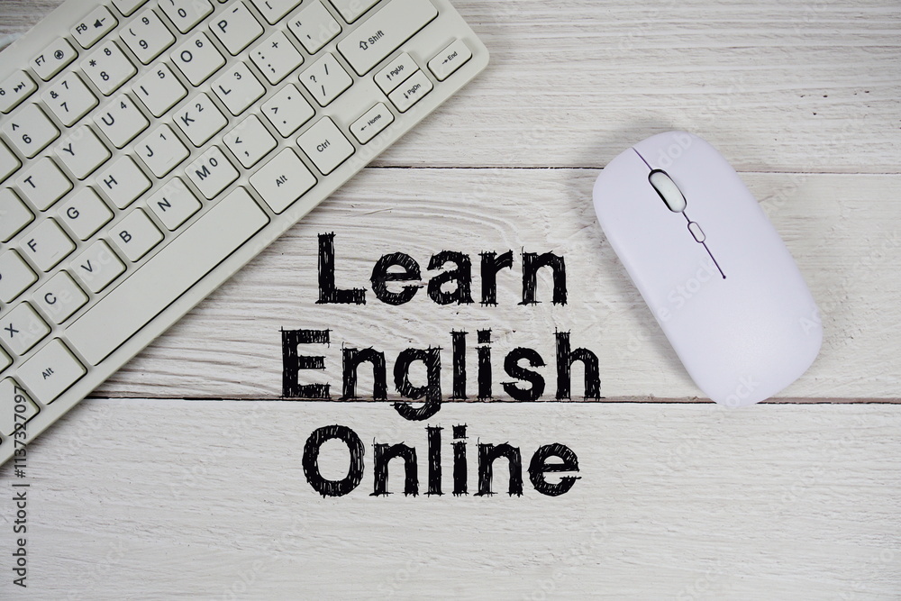 Aufkleber learn english online text with keyboard and optical mouse on wooden background