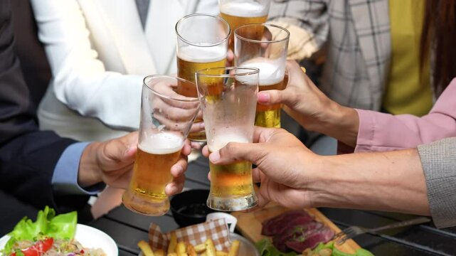 food and drink male friends are happy drinking beer and clinking glasses at a bar or pub.