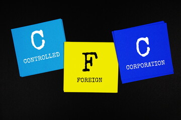 CFC - Controlled Foreign Corporation acronym text on sticky note on black background