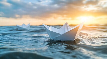 Obraz premium Paper Boats Sailing into a Golden Sunset: A Serene Seascape