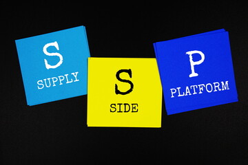 SSP - Supply Side Platform acronym text on sticky note on black background