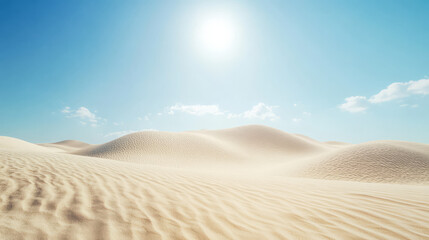 Naklejka premium Bright sunlight illuminates vast sand dunes under a clear blue sky in the desert