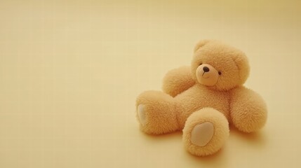 Soft Yellow Teddy Bear on Warm Yellow Background for Children's Themes
