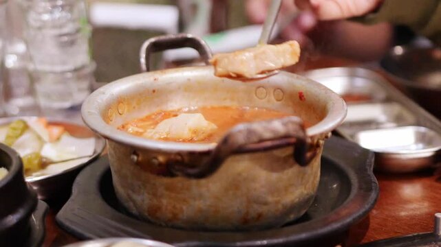 Eating kimchi jjigae from a famous restaurant in Seoul, South Korea