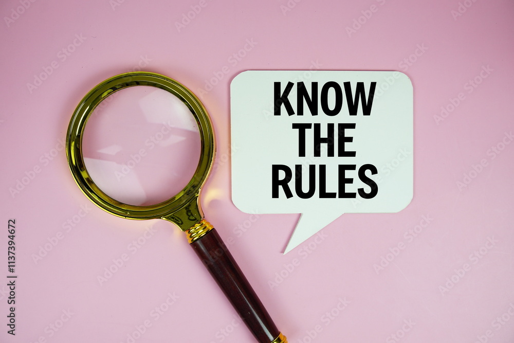 Poster know the rules text on speech bluble with magnifying glass top view on pink background