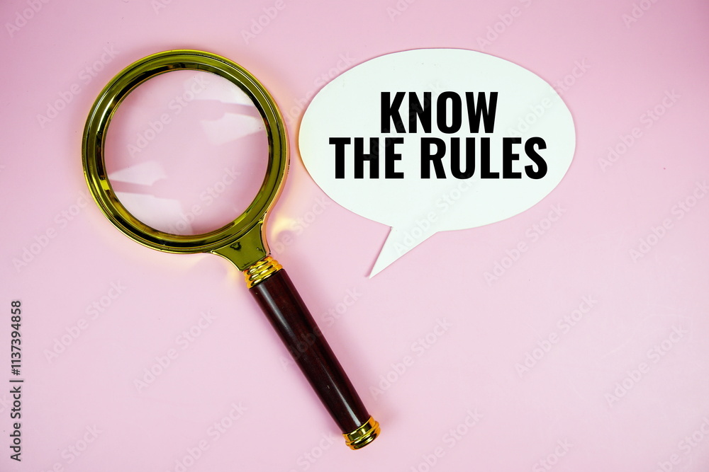 Poster know the rules text on speech bluble with magnifying glass top view on pink background