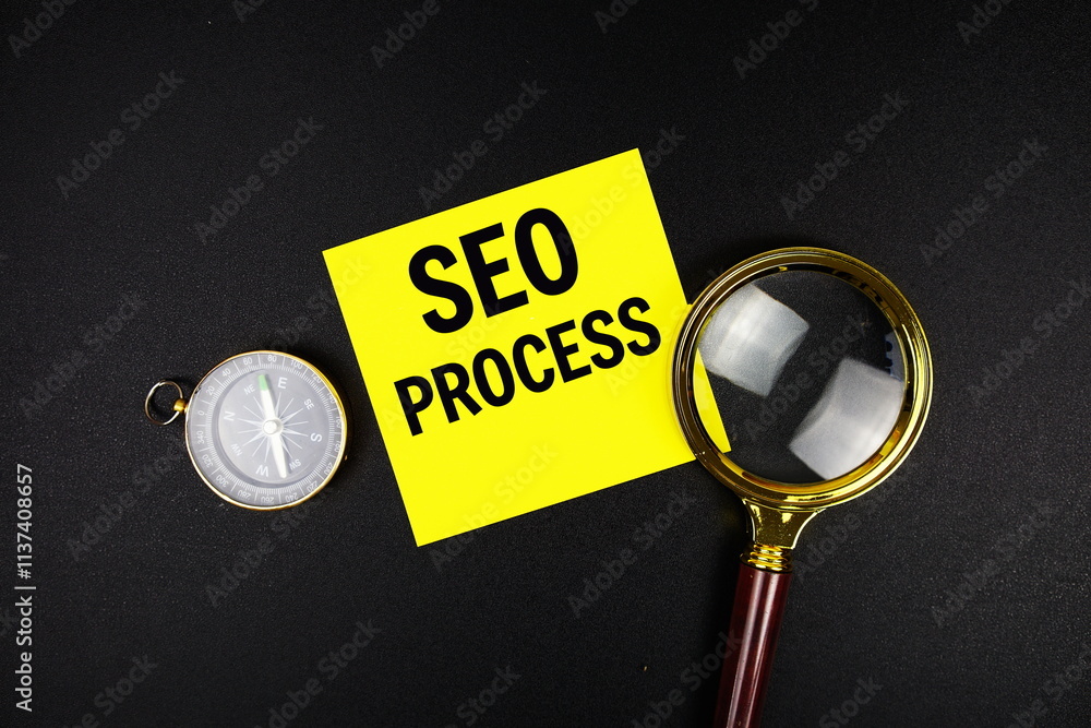 Aufkleber seo process text message on sticky note with magnifying glass and compass on black background