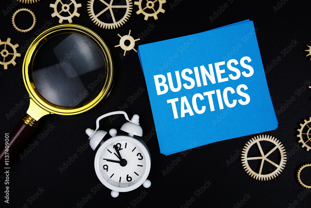 Poster business tactics text message on sticky note with magnifying glass and alarm clock on black backgrou