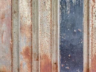 Close up of a rusted zinc metal surface.