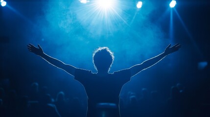 victorious person rear view, arms raised celebration, bright spotlight halo effect, dark audience silhouettes, professional event setting, dynamic victory pose, atmospheric blue tones