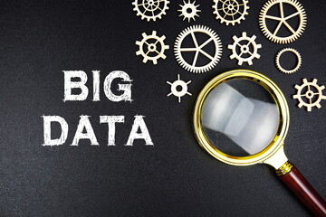 Big Data text message with magnifying glass on black background