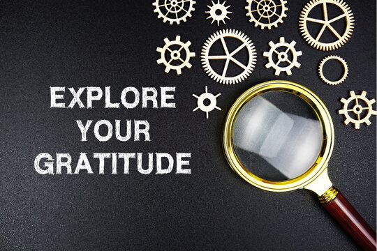 Explore Your Gratitude text message with magnifying glass on black background - Powered by Adobe