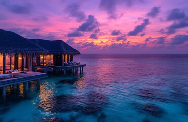 Overwater bungalows at sunset tropical ocean paradise