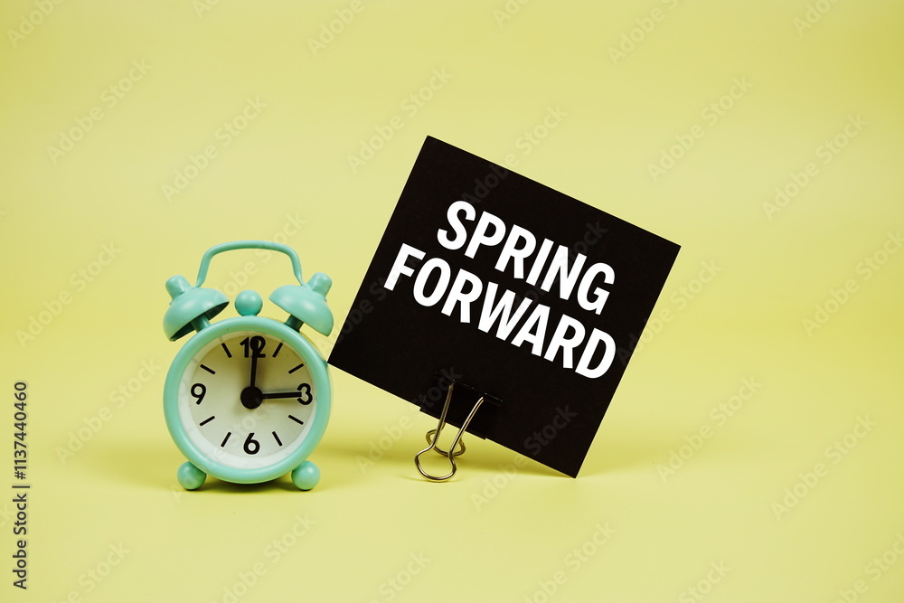 Poster spring forward text message on paper card with alarm clcok on yellow background